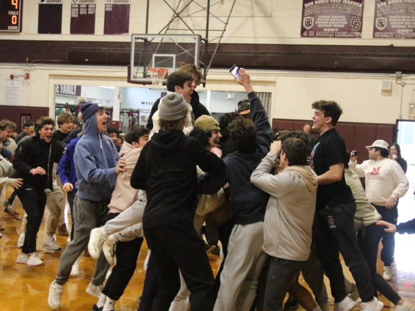 A group of Don Bosco Students cheered and jumped because their team one.